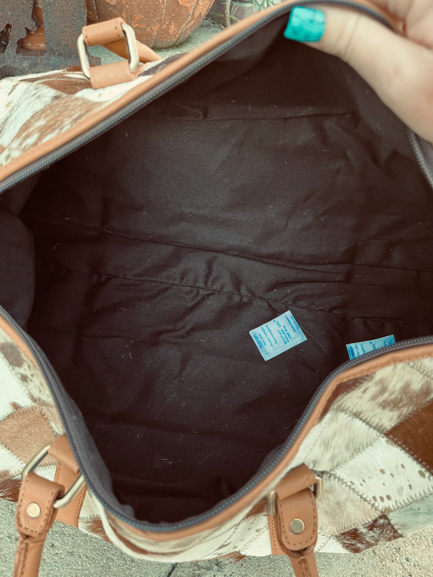 Tan+white cowhide duffel bag
