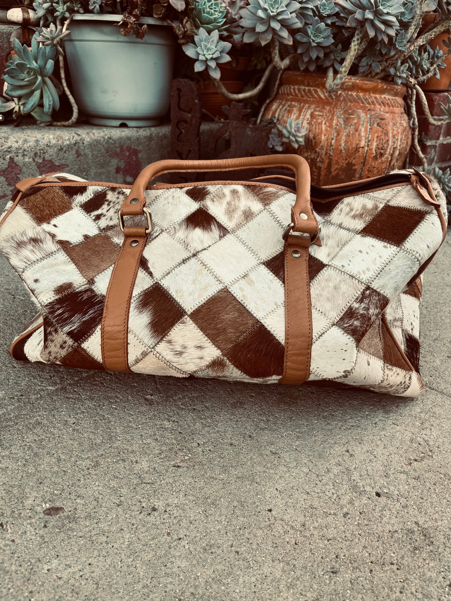 Tan+white cowhide duffel bag