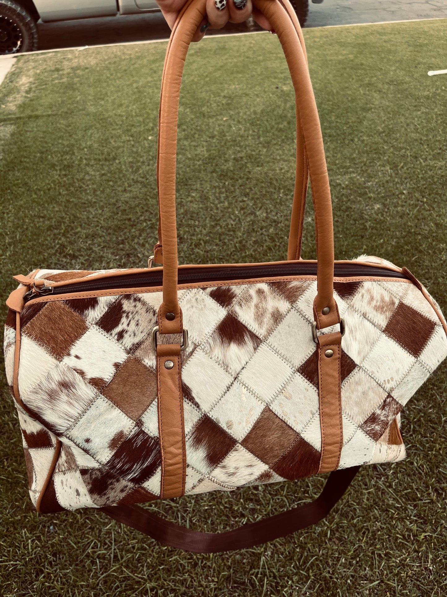 Tan+white cowhide duffel bag
