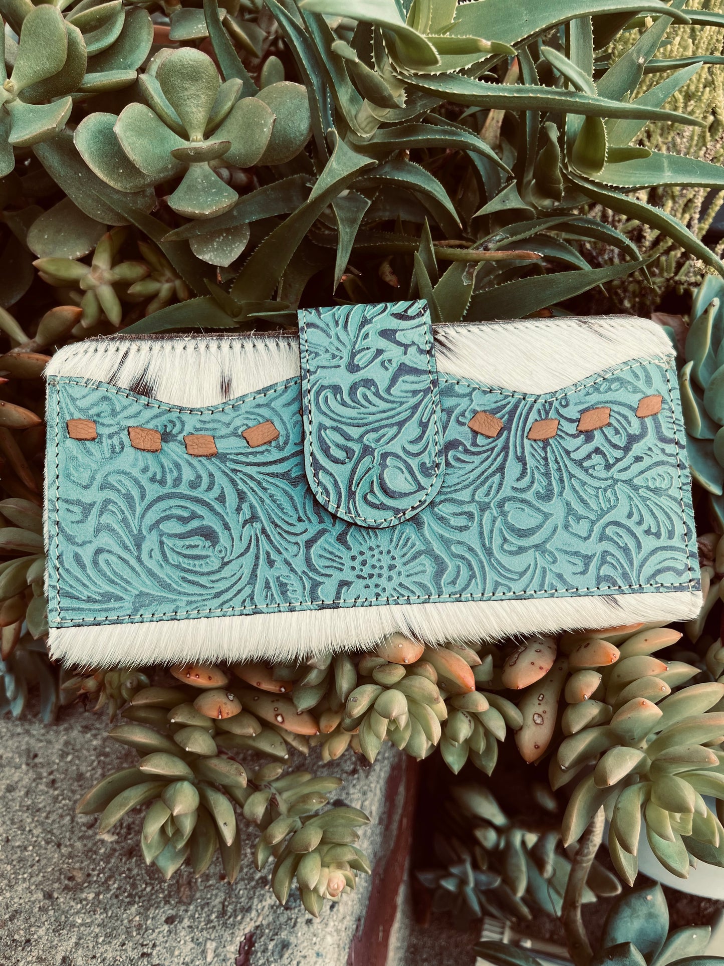 The tooled turquoise wallet