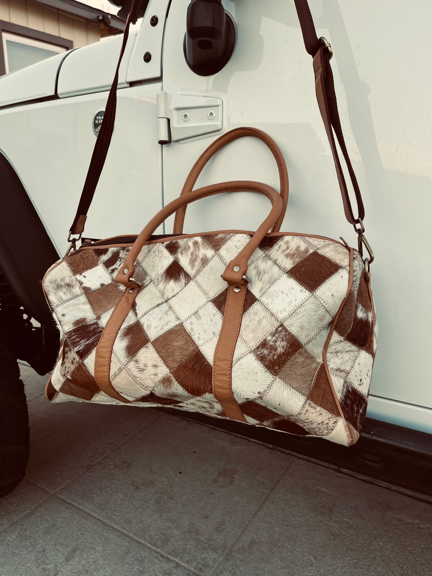 Tan+white cowhide duffel bag
