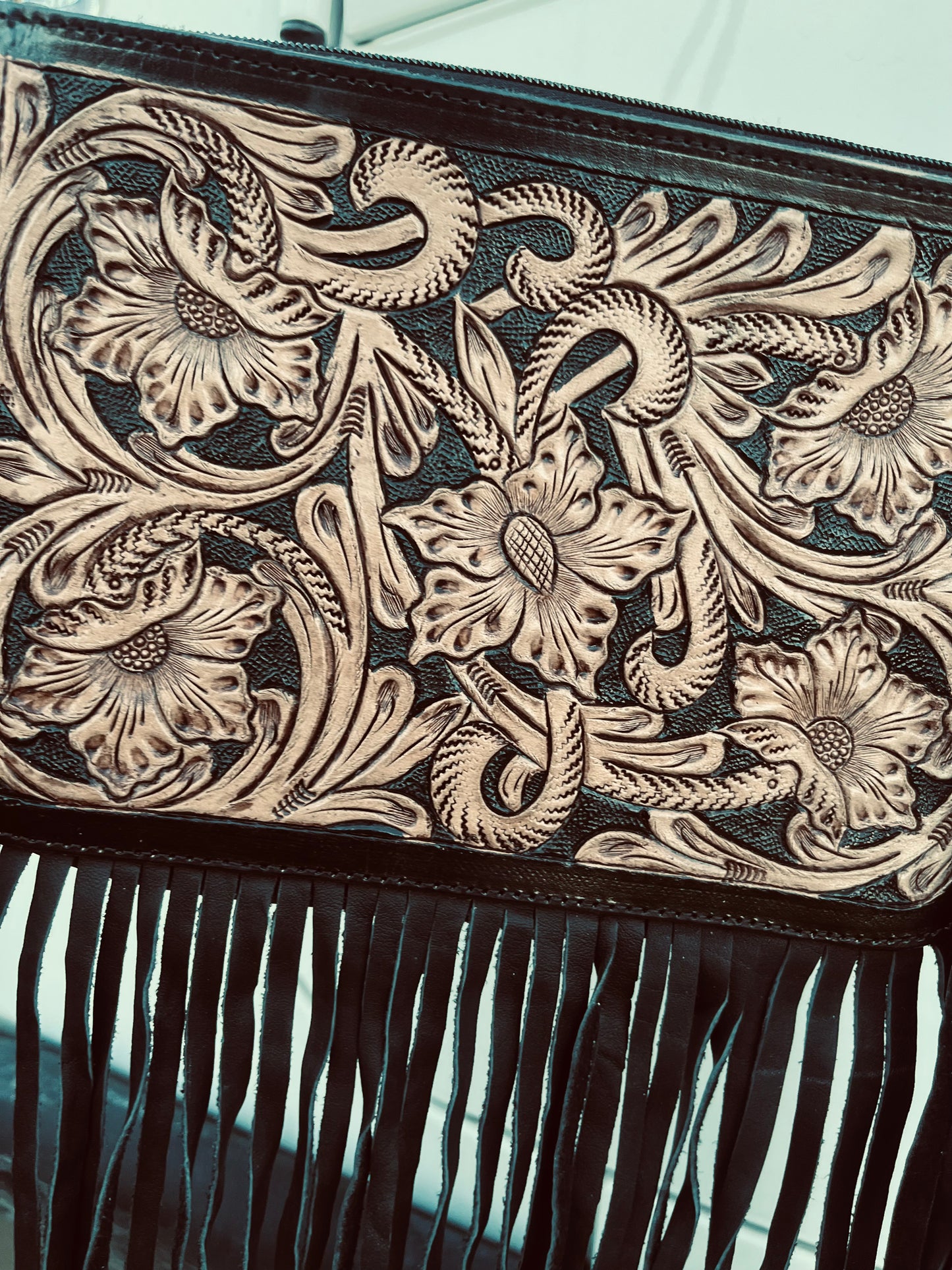 The blacked tooled crossbody