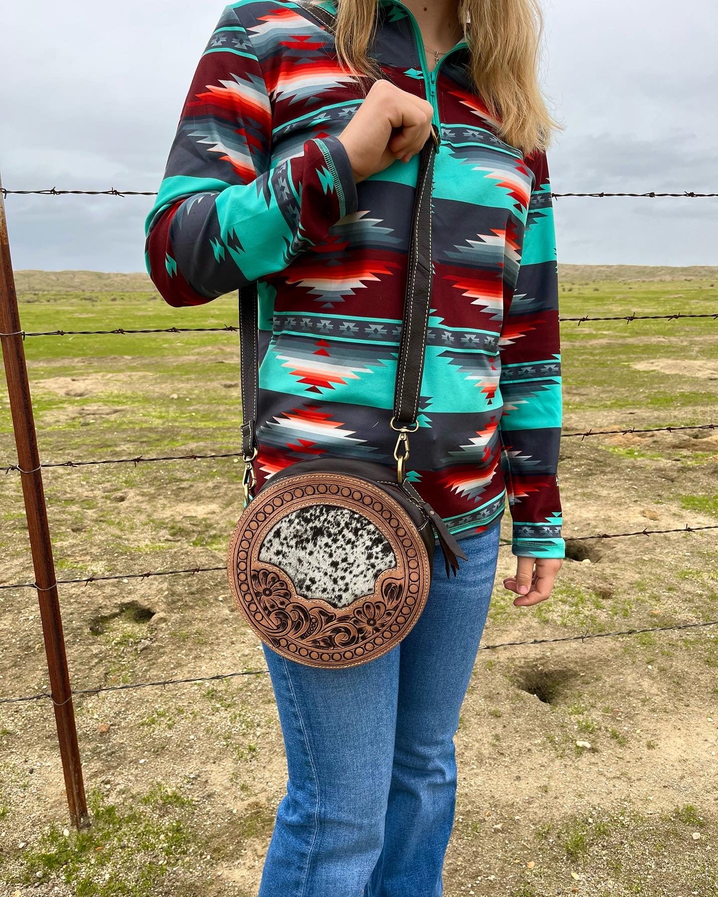 Tooled round cowhide purse