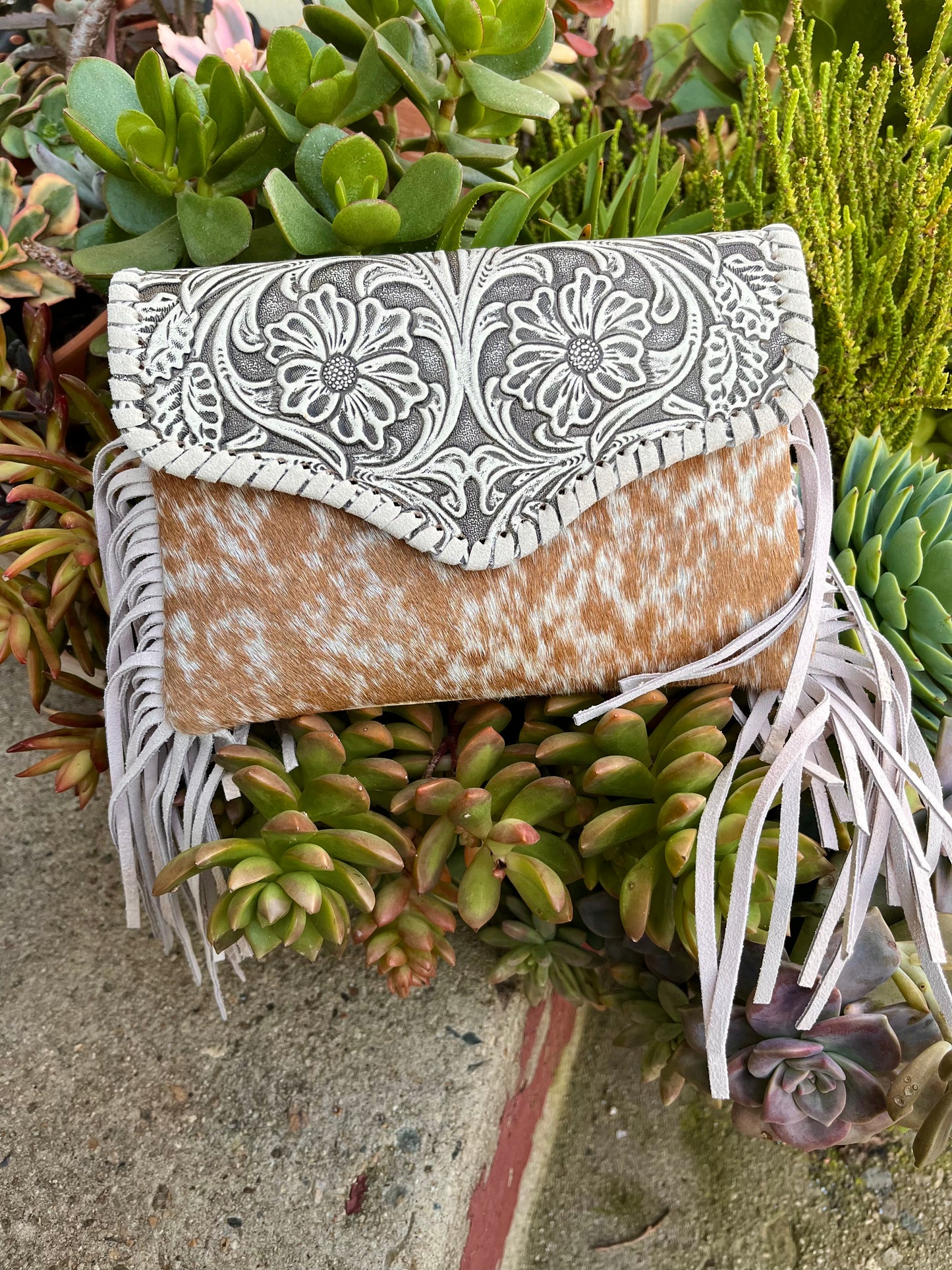 Tooled crossbody clutch