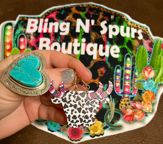 cow print long horn earrings.